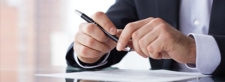 businessman-signing-contract-document-paperwork-agreement
