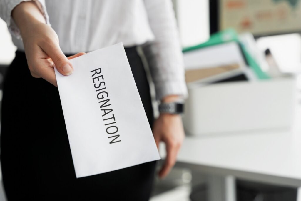 person-holding-resignation-letter-in-office
