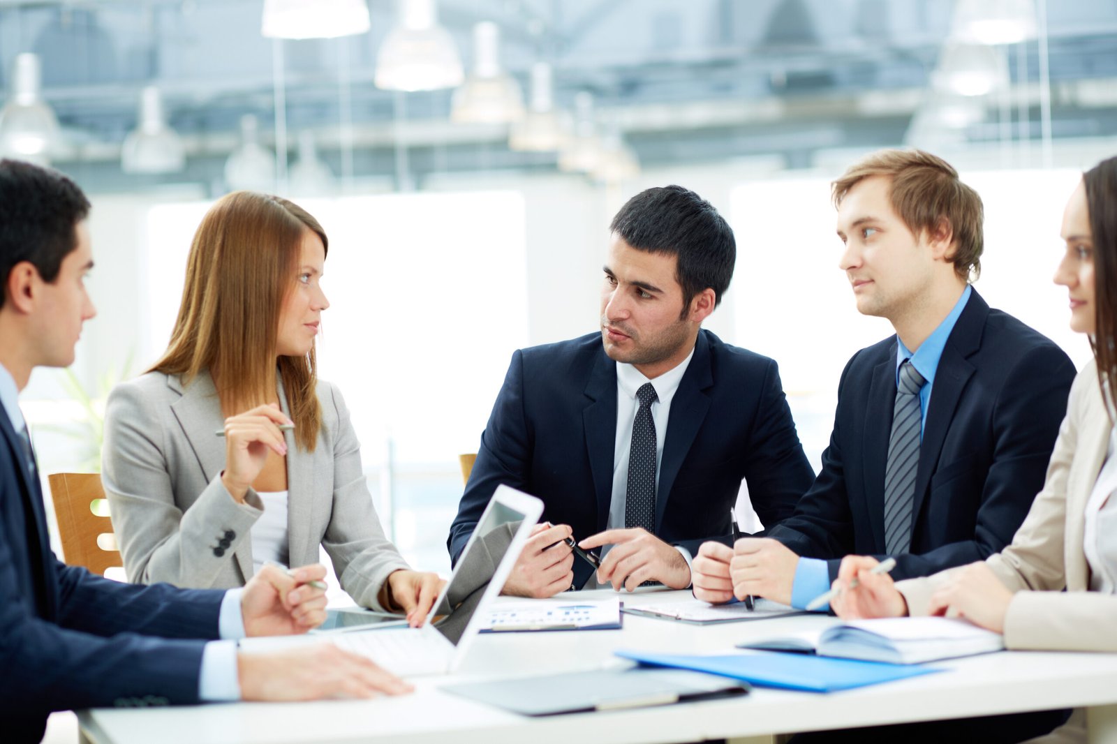 three-business-professionals-having-a-meeting-in-a-bright-office